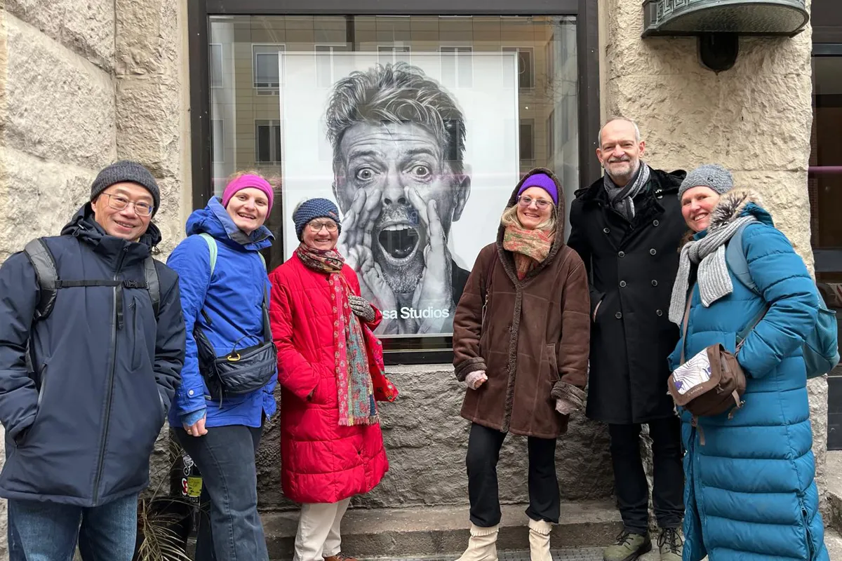 Group posing in front of the Hansa Studio during a David Bowie Walking Tour