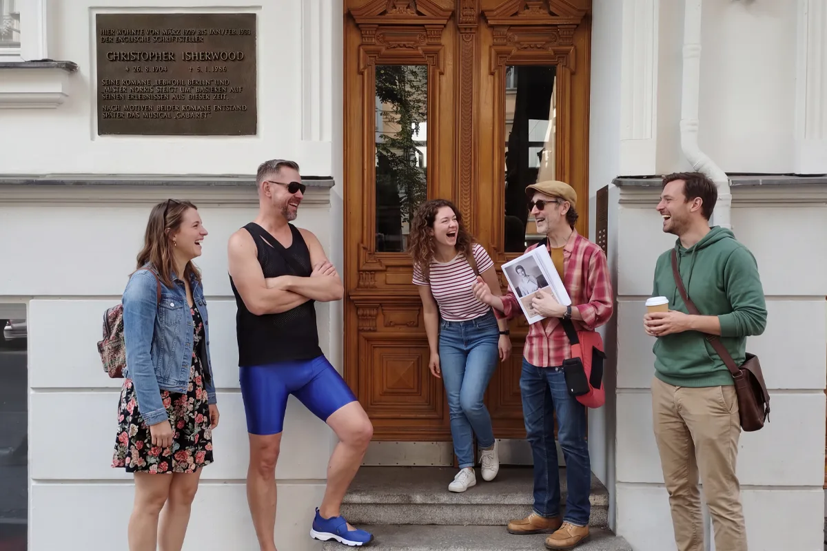 Tour group on the Queer Berlin History Tour in front of the house where CHristopher Isherwood lived in Berlin
