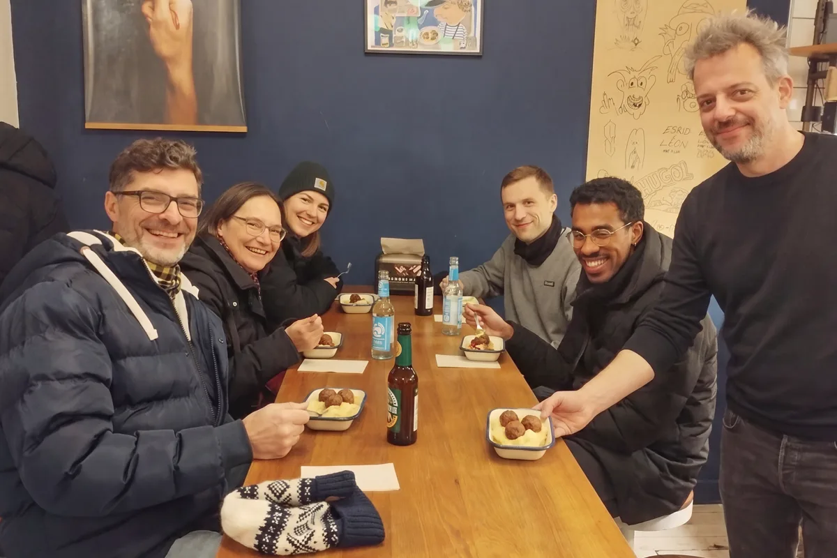 Guests of the Gastro Tour with Swedish Köttbullar just being served, Schlesische Straße, Kreuzberg